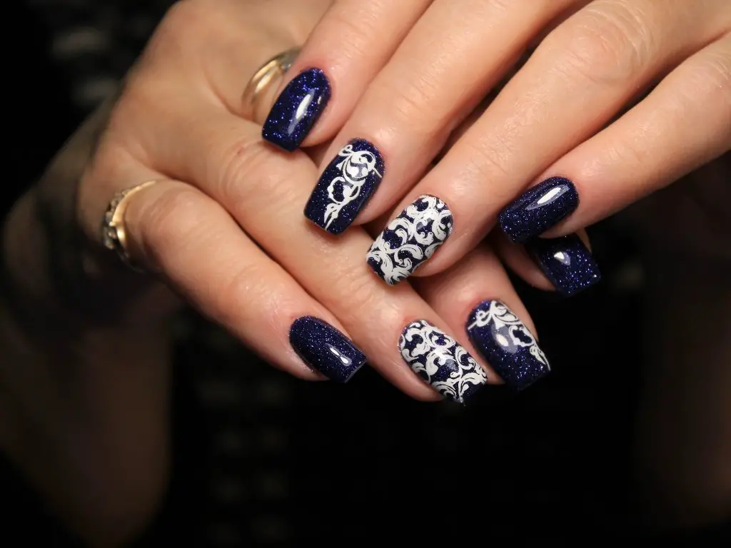 halloween nail trends 2025 spooky chic nail art designs with eco friendly polish eco friendly halloween manicure with metallic accents and matte black nails intricate halloween nail art with negative space and freehand ghost designs halloween nail colors 2025 deep jewel tones with gold and silver accents